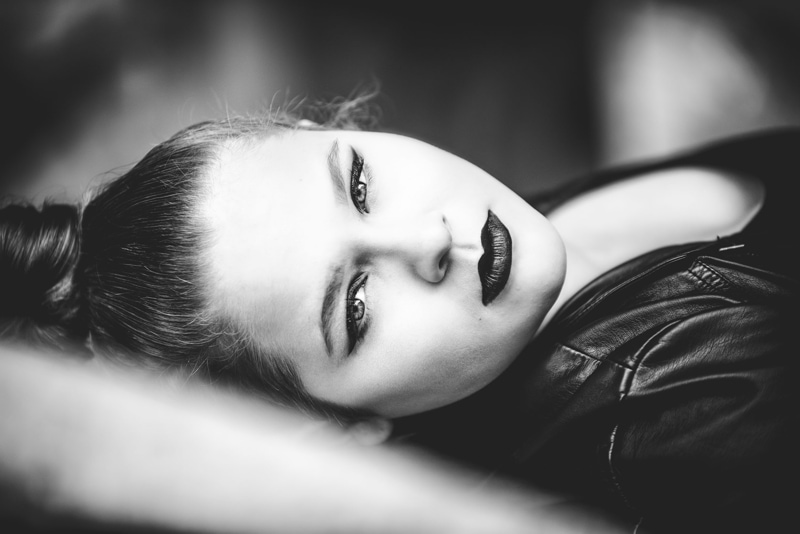 Denver Senior Photography, black and white close up of girl laying on her back